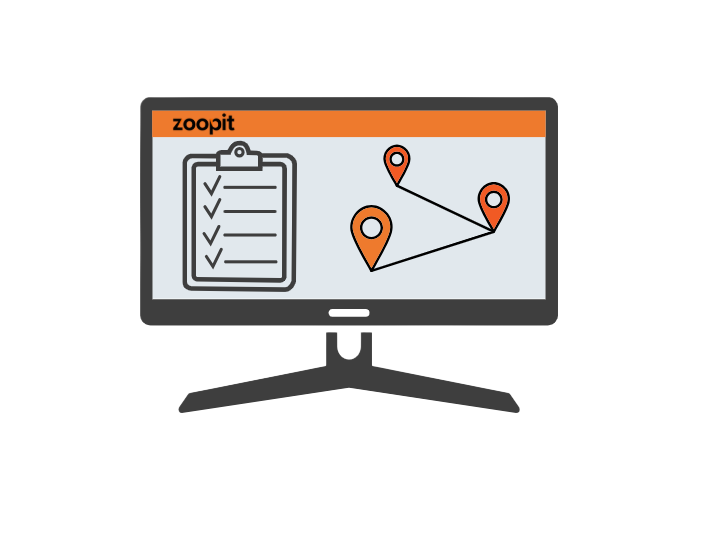 en datorskärm med en skrivplatta och orangefärgade stift